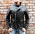 An 80's Metal Bullet black leather jacket in a classic design with a red quilted lining, large collar, silver metal zips and buckles.