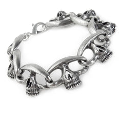 A silver pewter bracelet with a linked skull design.