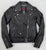 A classic black leather jacket with epaulets on the shoulders, high collar, zipped cuffs, adjustable belt, multiple pockets and a silver satin effect lining.