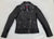 A classic black leather jacket with epaulets on the shoulders, high collar, zipped cuffs, adjustable belt, multiple pockets and a silver satin effect lining.
