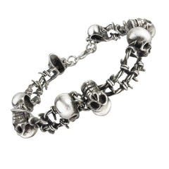 A silver pewter bracelet, featuring a ring of skulls linked by barbed wire.