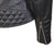 Close up of the cuff zip on a black leather jacket with padded diamond stitching across the shoulders and lower back, featuring zipped cuffs and a high collar.