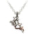 A silver colored pewter tattoo gun pendant with an antique scroll wrapped around it on a neck-chain.