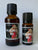 Two bottles of 80's Metal Heavy Metal Patchouli Oil, one 10ml and one 30ml, with black caps and labels.