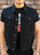 A black denim battlejacket with ripped and stitched arm holes, chest and side pockets and custom 