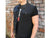 A black denim cut-off battle-jacket featuring ripped & stitched arm holes, chest and side pockets and a collared neckline.