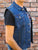 A blue denim cut-off battle-jacket featuring ripped & stitched arm holes, chest and side pockets and a collared neckline.