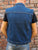 A blue denim cut-off battle-jacket featuring ripped & stitched arm holes, chest and side pockets and a collared neckline.