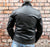 An 80's Metal Bullet black leather jacket in a classic design with a red quilted lining, large collar, silver metal zips and buckles.