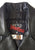 Close up of the neck patch on the inside of a metalworks leather jacket featuring Judas Priest 'Sad Wings Of Destiny' on the back, with epaulets, multiple pockets, adjustable belt and high quality zips.  