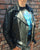 A metalworks leather jacket featuring Judas Priest 'Sad Wings Of Destiny' on the back, with epaulets, multiple pockets, adjustable belt and high quality zips.  