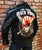 A metalworks leather jacket featuring Five Finger Death Punch 'Got Your Six' on the back, with epaulets, multiple pockets, adjustable belt and high quality zips.  
