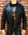 A metalworks leather jacket featuring Five Finger Death Punch 'Got Your Six' on the back, with epaulets, multiple pockets, adjustable belt and high quality zips.  