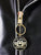 A close up of the zip pull on a metalworks leather jacket featuring Five Finger Death Punch 'Got Your Six' on the back, with epaulets, multiple pockets, adjustable belt and high quality zips.  