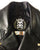 Close up of the inside neck patch on a metalworks leather jacket featuring Five Finger Death Punch 'Got Your Six' on the back, with epaulets, multiple pockets, adjustable belt and high quality zips.  