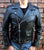 A metalworks leather jacket featuring Ozzy Osbourne 'Ordinary Man' on the back, with epaulets, multiple pockets, adjustable belt and high quality zips.  