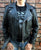 A metalworks leather jacket featuring Ozzy Osbourne 'Ordinary Man' on the back, with epaulets, multiple pockets, adjustable belt and high quality zips.  
