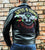A metalworks leather jacket featuring Guns N Roses 'Los F'N Angeles' on the back, with epaulets, multiple pockets, adjustable belt and high quality zips.  
