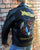 A metalworks leather jacket featuring Judas Priest 'Defenders Of The Faith' on the back, with epaulets, multiple pockets, adjustable belt and high quality zips.  