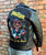 A metalworks leather jacket featuring Judas Priest 'Defenders Of The Faith' on the back, with epaulets, multiple pockets, adjustable belt and high quality zips.  