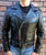 A metalworks leather jacket featuring Judas Priest 'Defenders Of The Faith' on the back, with epaulets, multiple pockets, adjustable belt and high quality zips.  
