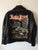 A metalworks leather jacket featuring Judas Priest 'Sad Wings Of Destiny' on the back, with epaulets, multiple pockets, adjustable belt and high quality zips.  