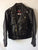 A metalworks leather jacket featuring Judas Priest 'Sad Wings Of Destiny' on the back, with epaulets, multiple pockets, adjustable belt and high quality zips.  