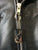 Close up of the zip pull on a metalworks leather jacket featuring Judas Priest 'Sad Wings Of Destiny' on the back, with epaulets, multiple pockets, adjustable belt and high quality zips.  